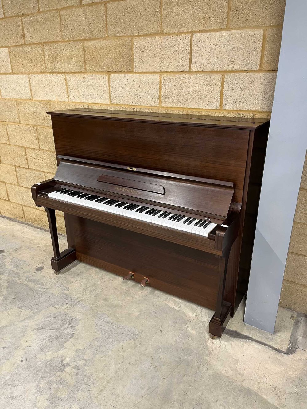 Bechstein (c1978) A Model 8 upright piano in a traditional satin mahogany case.