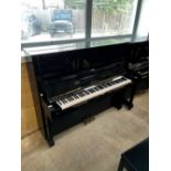 Yamaha (c1974) A Model U2 upright piano in a bright ebonised case; together with a matching stool.