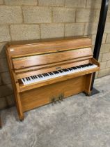 Knight (c1974) A School Model upright piano in an oak case.