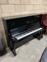 Kawai (c1981) A Model BL31 upright piano in a traditional bright ebonised case; together with a