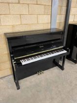 Essex (c2013) A Model EUP-123 upright piano in a bright ebonised case. There is VAT on this Lot.