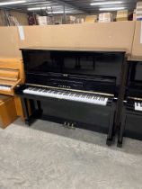 Yamaha (c1965) A Model U3D upright piano in a traditional bright ebonised case.