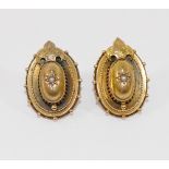 A pair of Victorian hollow gold oval earrings, each centrally set with a half seed pearl, with later