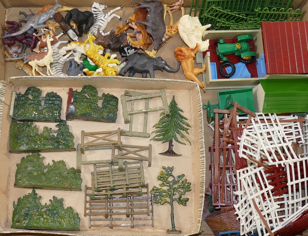 Two Britains die cast trees, hedgerow sections, fences and hurdles, (16 pieces) and a large