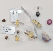 Three modern Ethiopian opal set rings, stamped '925', a similar opal pendant, also stamped '925',