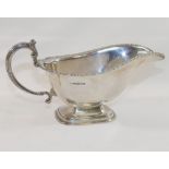 A George VI silver pedestal gravy boat, Sheffield 1939, by Mappin and Webb, raised on stepped