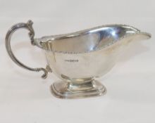 A George VI silver pedestal gravy boat, Sheffield 1939, by Mappin and Webb, raised on stepped