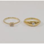 A yellow metal diamond single stone ring, the round brilliant cut stone approximately  0.25