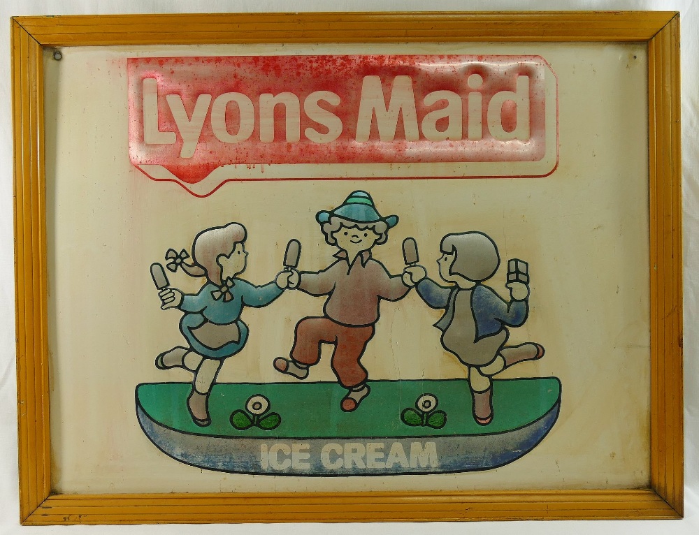 A tin 'Lyons Maid Ice Cream' advertising sign, 45cm x 60cm, housed in metal frameCONDITION REPORTS &