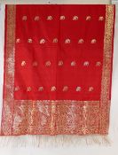 An Indian gold embroidered red scarf with gold tassels, and ten floral scarvesCONDITION REPORTS &