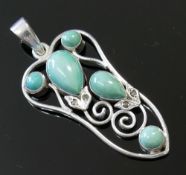 A selection of turquoise set jewellery comprised of an openwork pendant, two rings and four