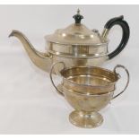 A silver teapot with ebonised handle and knop, and matching sugar bowl, Birmingham 1856, combined