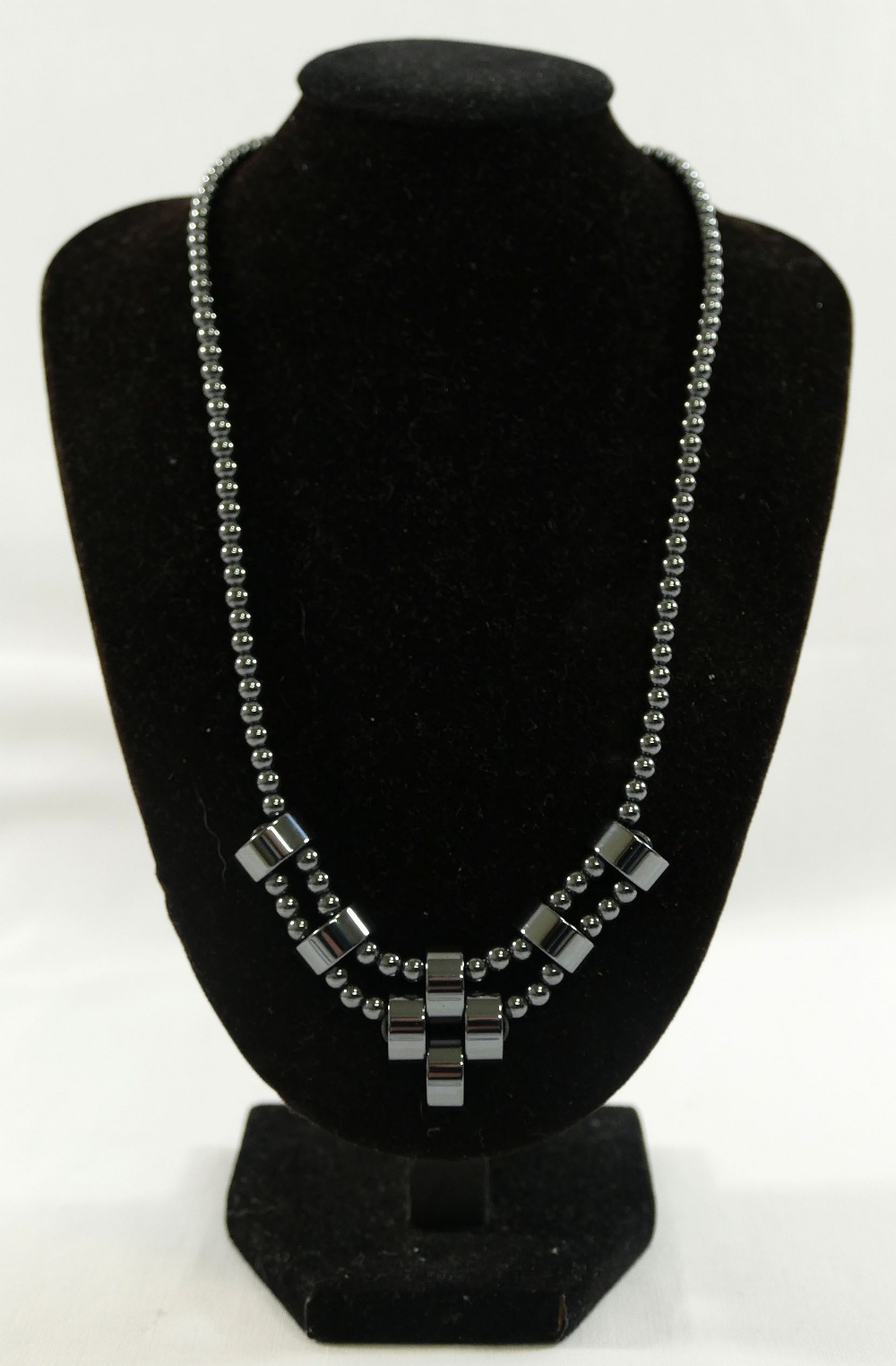 A selection of hematite jewellery comprised of a matching bracelet and necklace, another hematite