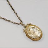 A Victorian yellow metal fancy link chain with barrel clasp, 4.6g, and an oval locket with gold