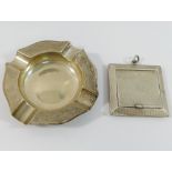 Two small silver items with engine turned decoration, comprised of a small square powder compact,