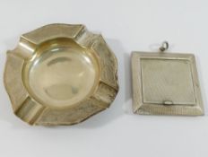 Two small silver items with engine turned decoration, comprised of a small square powder compact,