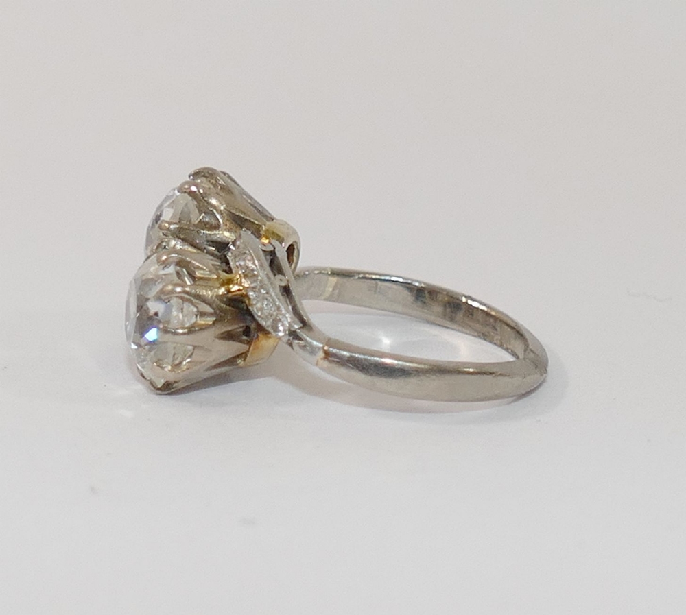 A diamond two-stone cross-over ring. the old-cut stones approximately 1.85 and 1.65 carats, I-J - Image 4 of 7