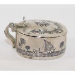 An Iraqi silver and niello salt and mustard pot decorated with sailing boats, with two matching