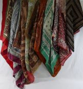 Fifteen silk and other scarves and handkerchiefs, predominately decorated with paisley and similar