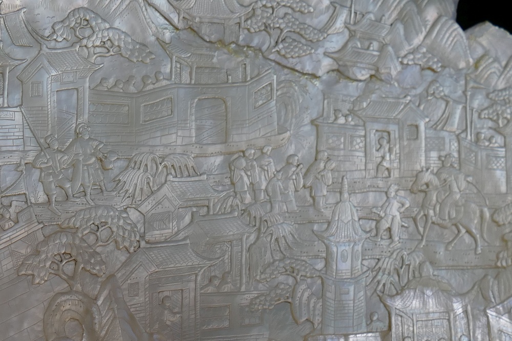 A large Chinese carved mother of pearl shell intricately decorated with a battle scene amongst - Image 2 of 7