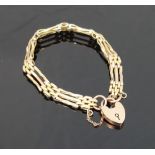 A fancy gate link three-row bracelet, with heart-shaped padlock clasp, bracelet and clasp stamped '