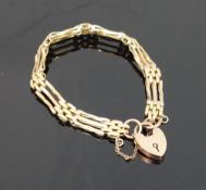 A fancy gate link three-row bracelet, with heart-shaped padlock clasp, bracelet and clasp stamped '