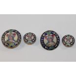 A set of four Italian enamel buttons, each decorated with the bust of an 19th century woman