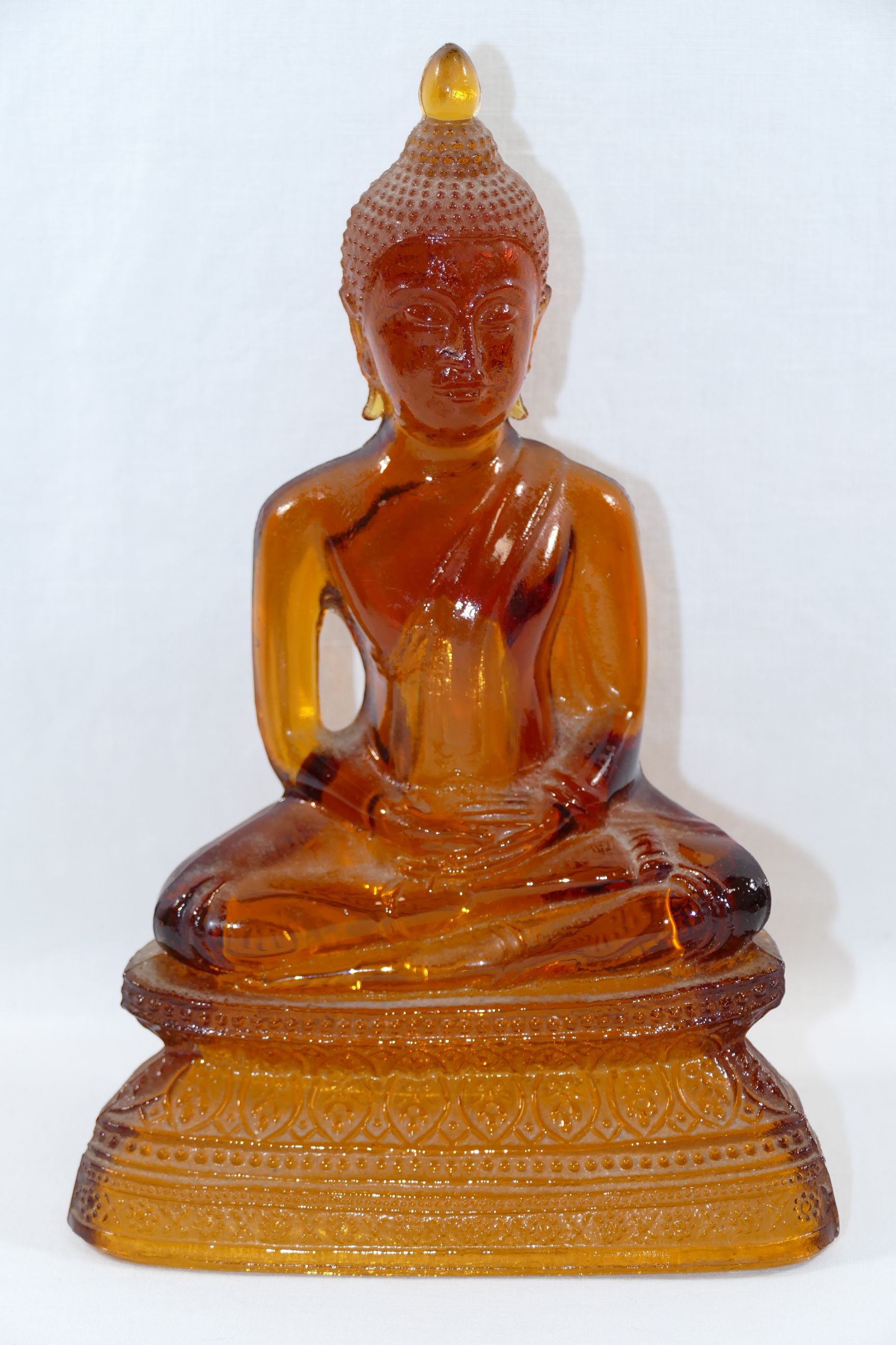 An amber glass seated Buddha, the hollow moulded glass figure depicted in the lotus position with - Image 4 of 4