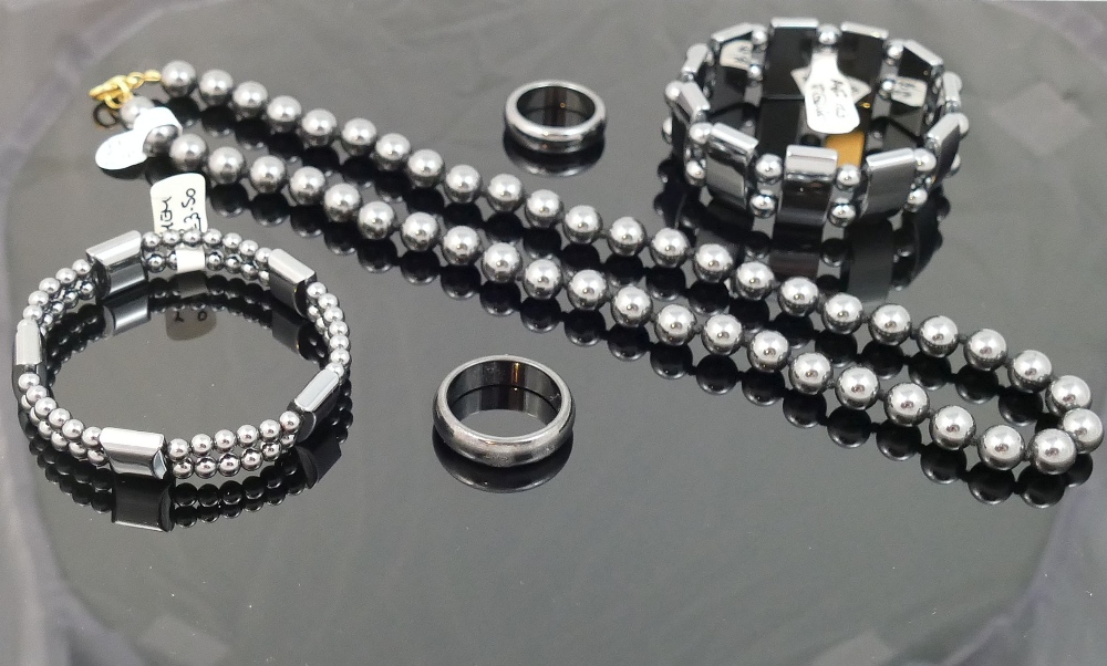 A quantity of hematite jewellery comprised of two bracelets, an individually knotted beaded