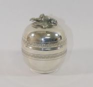 A  silver circular lidded box, the finial in the form of a pair of birds, stamped .900, 8cm high,
