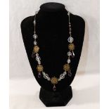 Five early 20th century and later paste set necklaces, including  a gold plated example set with