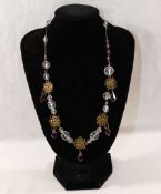 Five early 20th century and later paste set necklaces, including  a gold plated example set with