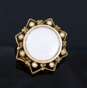 A small French gold seed pearl set brooch, with central circular glazed keepsake panel, and a