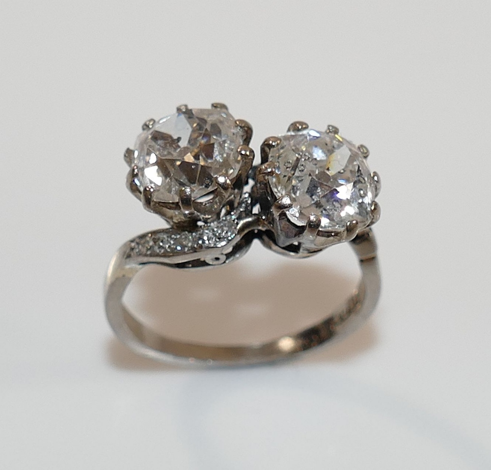 A diamond two-stone cross-over ring. the old-cut stones approximately 1.85 and 1.65 carats, I-J - Image 2 of 7