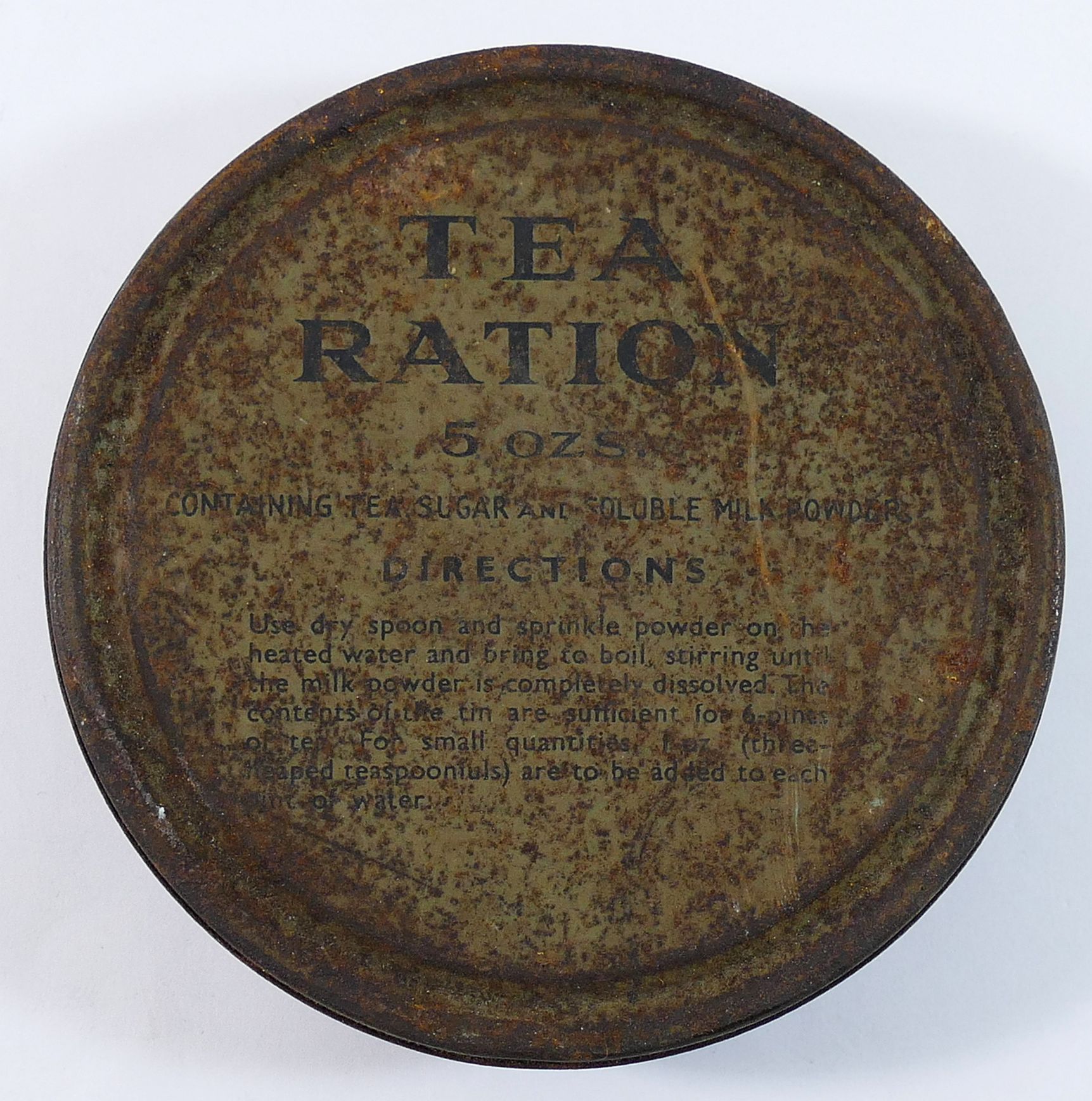 A WWII tea ration 5oz circular tin, 'Containing tea, sugar and soluble milk powder', with