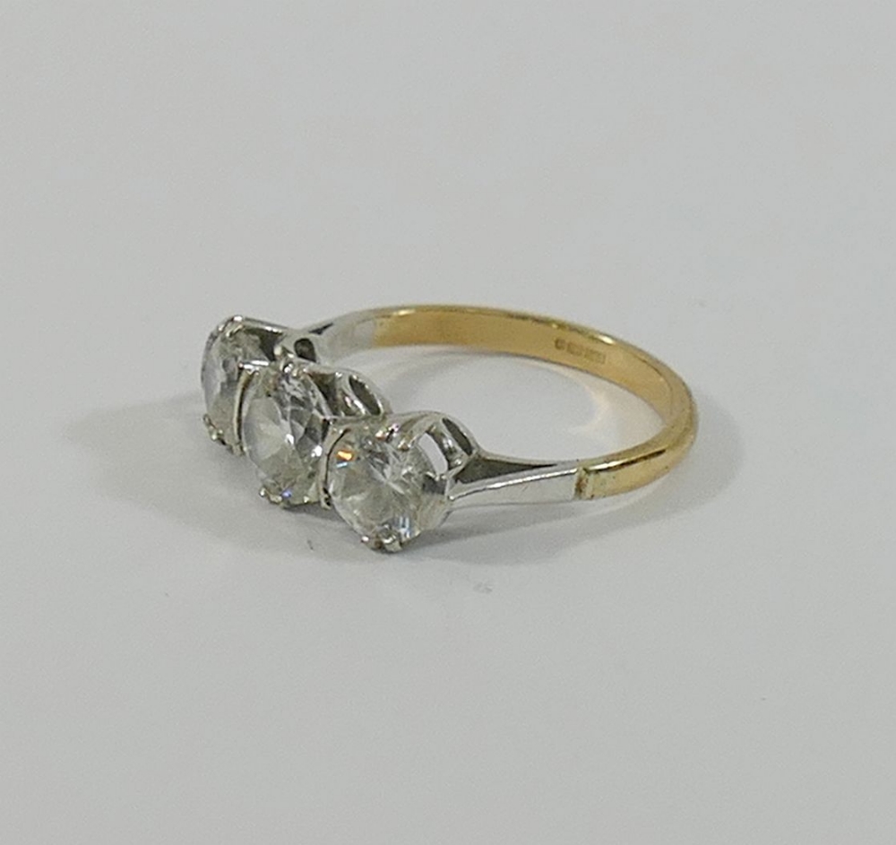 A 9 carat gold diamond simulant three-stone ring, the stones claw-set in white to a yellow shank, - Image 2 of 3