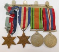 A WWII medal group comprised of the War medal, the Defence medal, the 1939-1945 Star and the