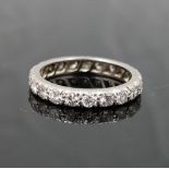 A diamond eternity ring, the 21 round brilliant cut diamonds each approximately 0.06 carats, set