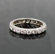 A diamond eternity ring, the 21 round brilliant cut diamonds each approximately 0.06 carats, set