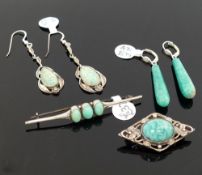 A selection of amazonite set jewellery comprised of a string of graduated beads, two brooches, three