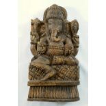 A carved wooden panel of Hindu god Ganesh, 28cm high, and another Indian figural carved wooden