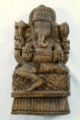 A carved wooden panel of Hindu god Ganesh, 28cm high, and another Indian figural carved wooden