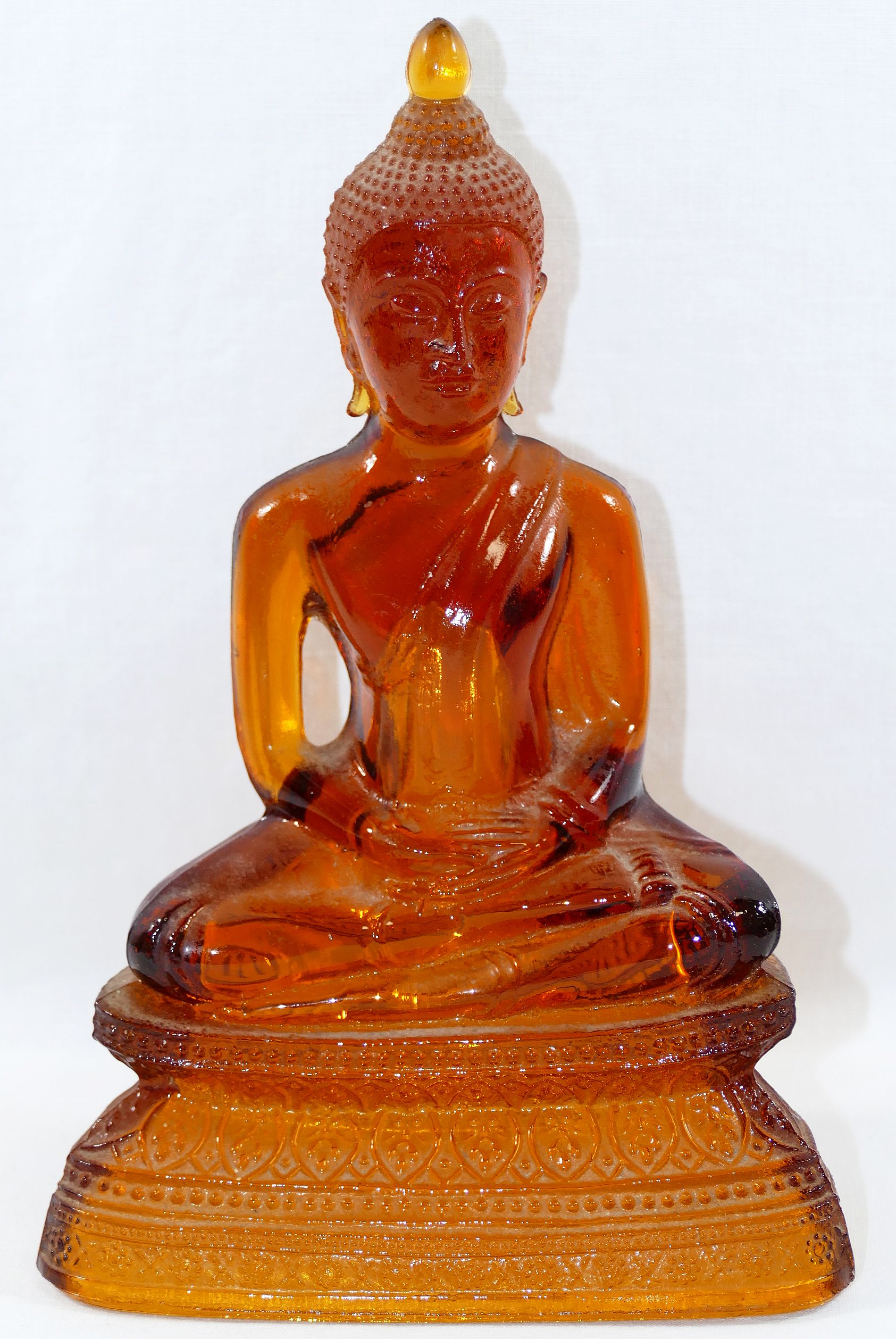 An amber glass seated Buddha, the hollow moulded glass figure depicted in the lotus position with - Image 2 of 4