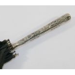 An Anglo-Indian silver handled black S Fox and Co. Paragon umbrella, the handle 15.5cm long embossed