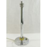 An Art Deco chrome plated table lamp, the hexagonal stem mounted to a Bakelite disc above a circular