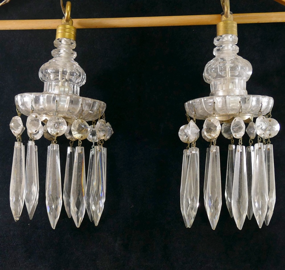 A pair of lustre hung ceiling lights, suspended from brass hooks, 9.8cm wide, 25cm dropCONDITION