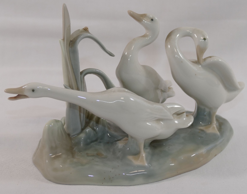 A Lomonosov USSR porcelain giraffe in seated position, 26cm long, and a Lladro porcelain geese - Image 2 of 2