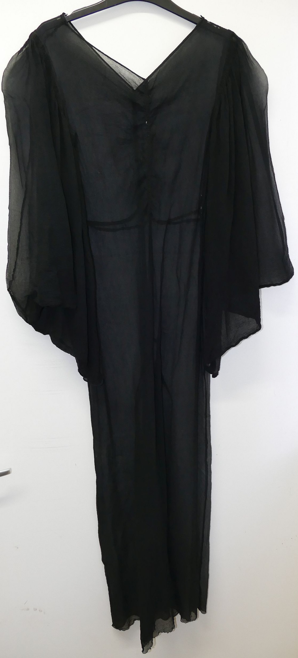 A vintage full length black slip dress, a black sheer full length dress and one other vintage