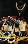 A paste set bracelet and a matched necklace, a black onyx pendant and a large selection of 20th