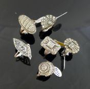 A collection of 12 marcasite set rings, most stamped 'silver' or '925', including a range of sizes